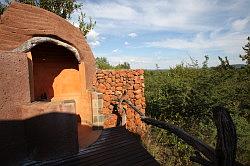 Madikwe - de Madikwe Safari Lodge; de kamers - de buitendouche