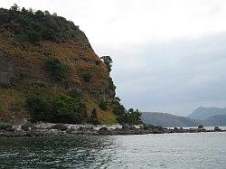 Anilao - Eagle Point beach resort; met de boot naar de duikstek - eiland hoort bij het resort